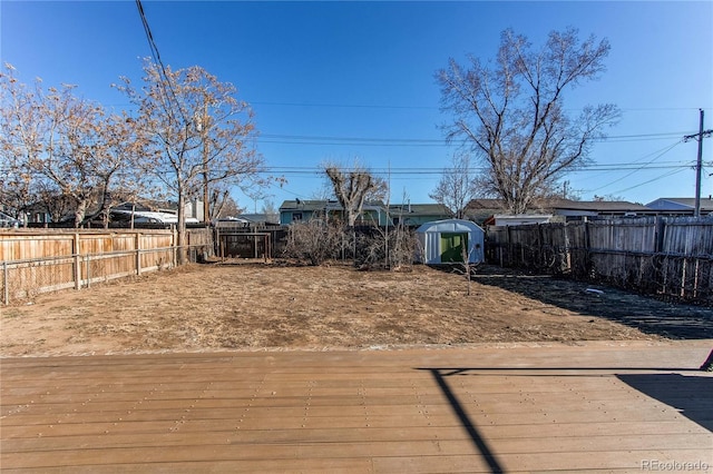 view of yard with a wooden deck