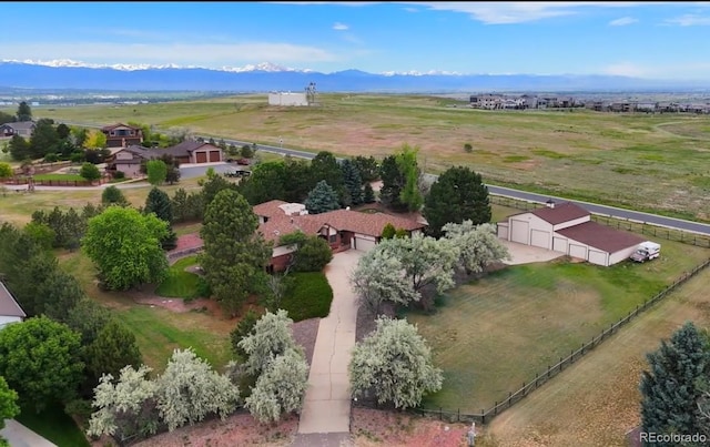 birds eye view of property featuring a mountain view and a rural view