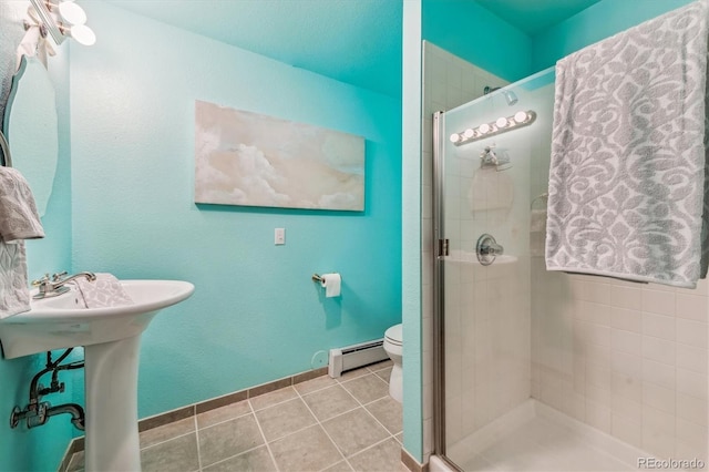 bathroom with a shower with door, tile patterned flooring, a baseboard radiator, and toilet