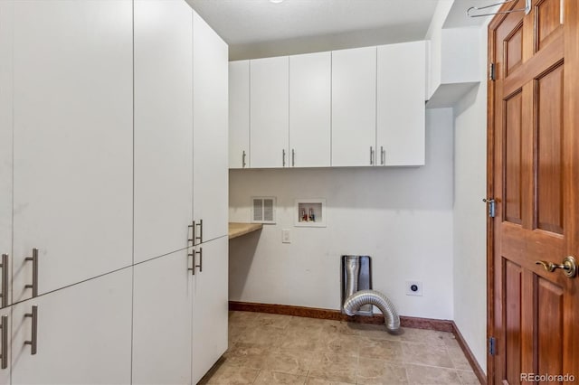 laundry area with electric dryer hookup, cabinets, and hookup for a washing machine