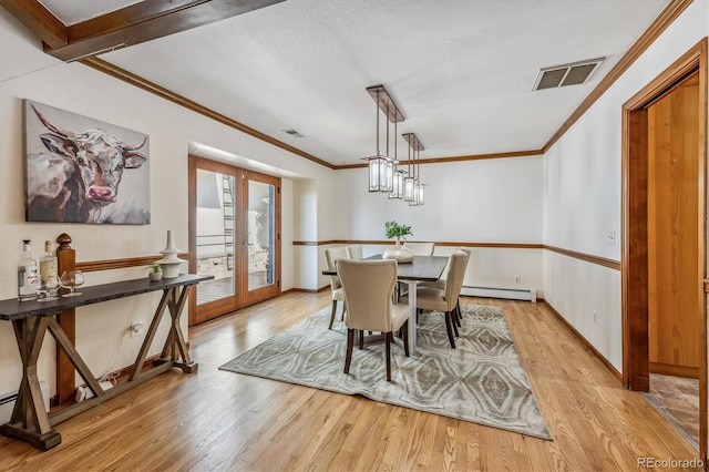 dining space featuring light hardwood / wood-style floors, french doors, a textured ceiling, and a baseboard radiator