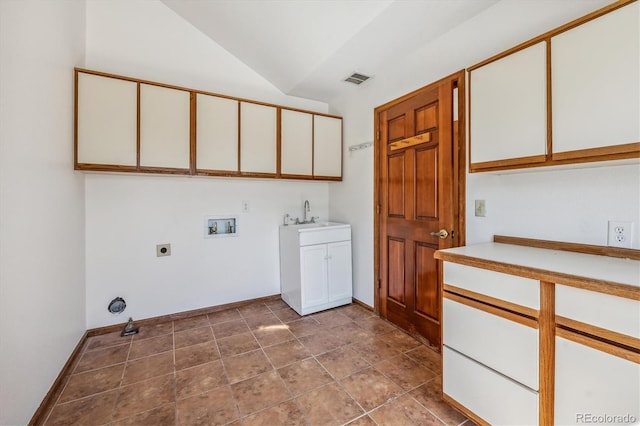 washroom with electric dryer hookup, cabinets, sink, washer hookup, and tile patterned flooring