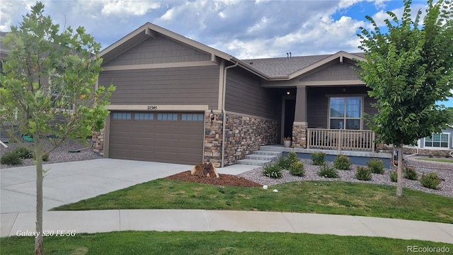 view of front of property featuring a garage and covered porch