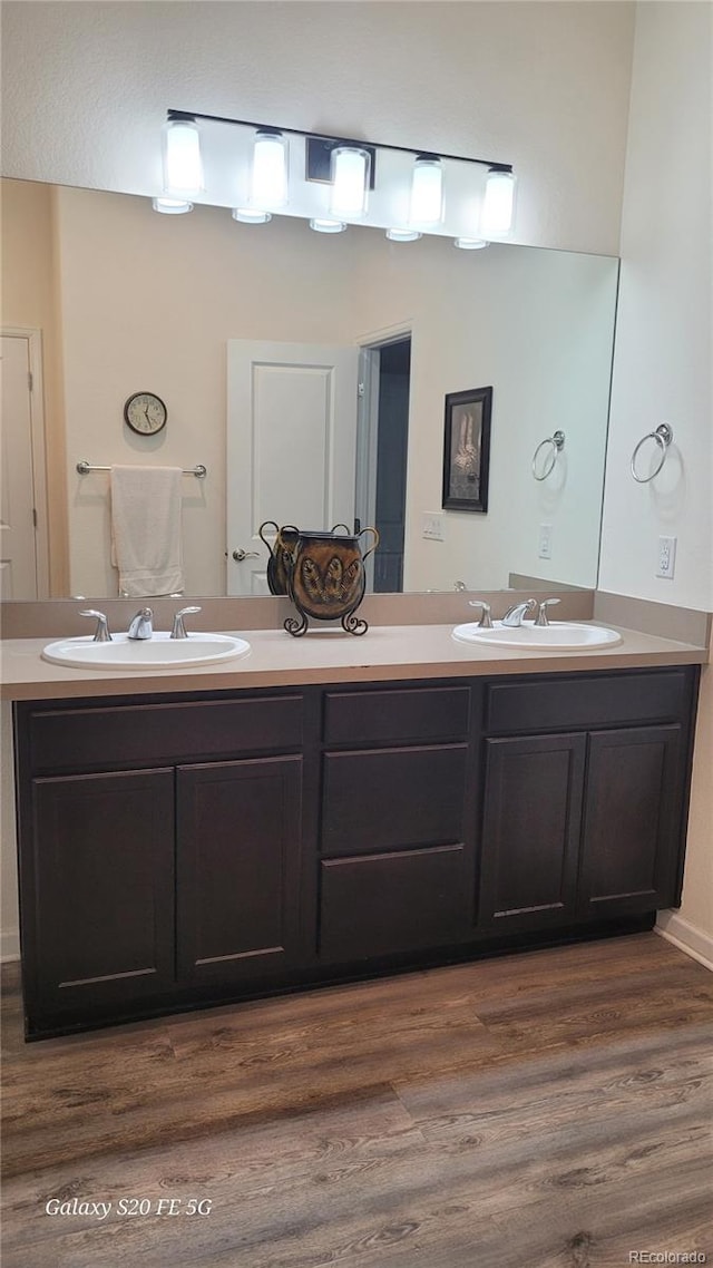 bathroom featuring hardwood / wood-style floors and vanity