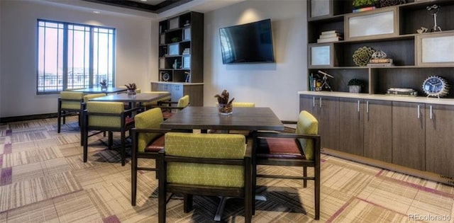 dining room with a tray ceiling