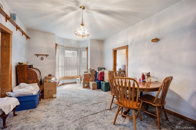 2402 W Uintah St, Colorado Springs, CO 80904 - dining space featuring carpet flooring and a chandelier