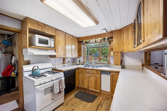 2402 W Uintah St, Colorado Springs, CO 80904 - kitchen featuring white appliances, under cabinet range hood, open shelves, light countertops, and light wood-style flooring