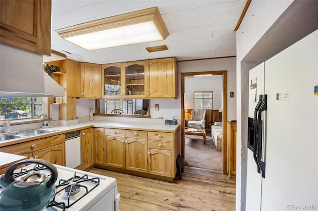 2402 W Uintah St, Colorado Springs, CO 80904 - kitchen with white appliances, light wood-style flooring, light countertops, glass insert cabinets, and open shelves