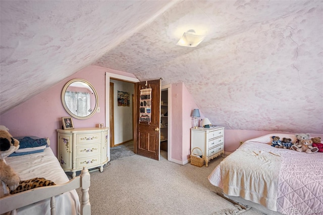 2402 W Uintah St, Colorado Springs, CO 80904 - carpeted bedroom with vaulted ceiling and a textured ceiling