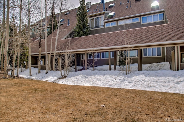 21650 US Highway 6 Unit 2096, Dillon, CO 80435 - snow covered rear of property featuring a yard