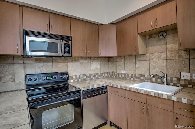 21650 US Highway 6 Unit 2096, Dillon, CO 80435 - kitchen with stainless steel appliances, backsplash, and tile countertops