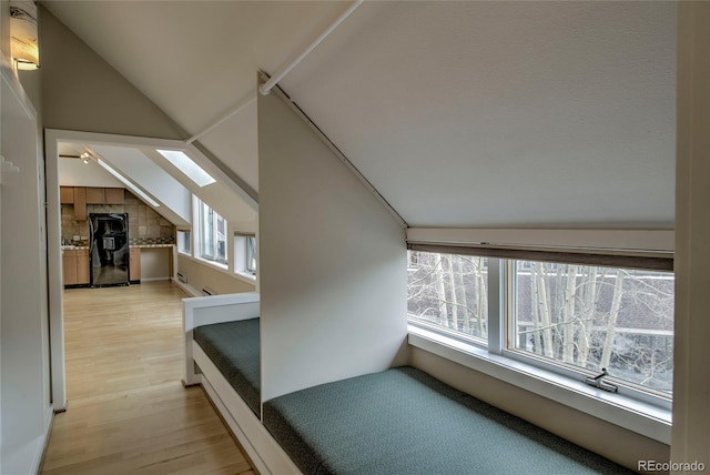 21650 US Highway 6 Unit 2096, Dillon, CO 80435 - additional living space with vaulted ceiling, healthy amount of natural light, and light wood finished floors