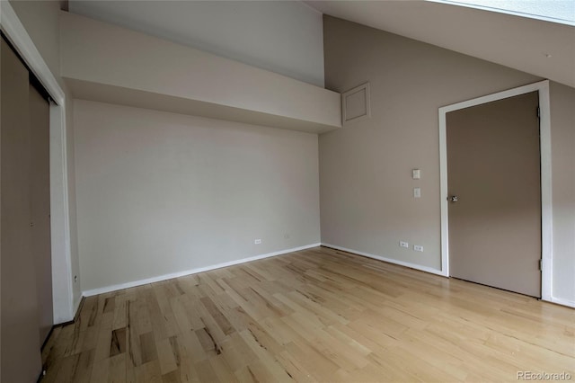 21650 US Highway 6 Unit 2096, Dillon, CO 80435 - unfurnished bedroom featuring wood finished floors, vaulted ceiling, and a closet