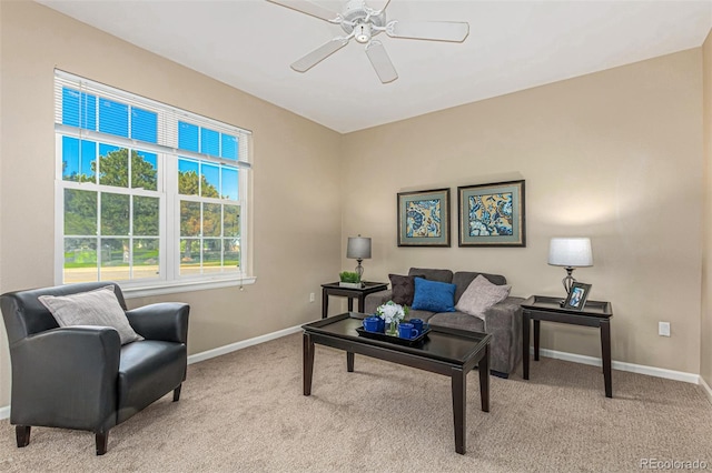 interior space with carpet flooring, baseboards, and a ceiling fan