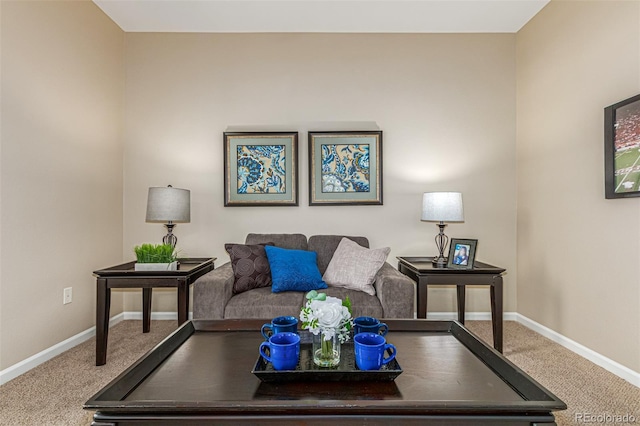 carpeted living room featuring baseboards