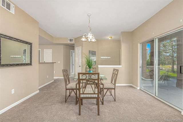 dining area featuring visible vents, baseboards, a chandelier, and carpet flooring