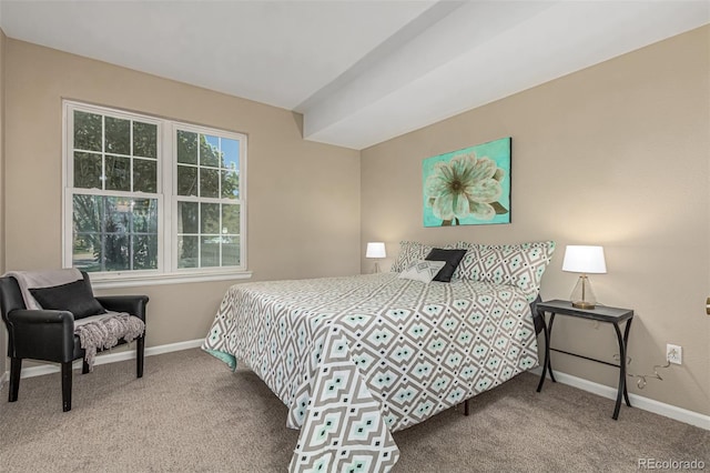 carpeted bedroom featuring baseboards