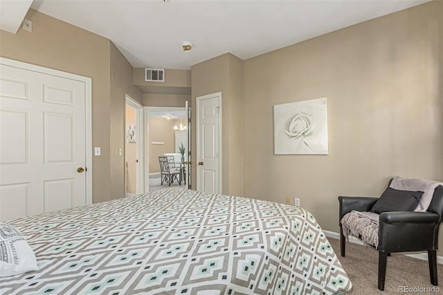 bedroom featuring visible vents and carpet flooring