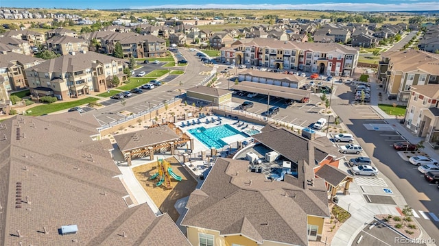 birds eye view of property with a residential view