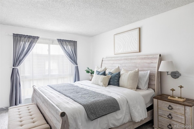 9453 W Utah Pl, Lakewood, CO 80232 - carpeted bedroom featuring a textured ceiling
