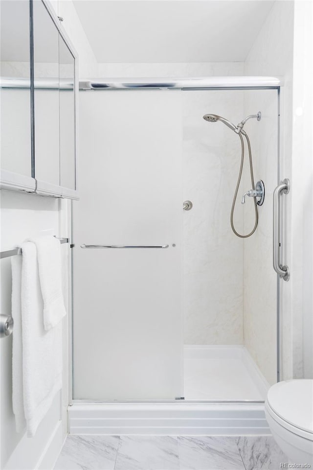 9453 W Utah Pl, Lakewood, CO 80232 - full bath featuring marble finish flooring, a shower stall, and toilet