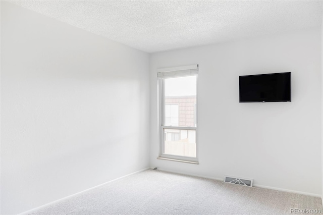 9453 W Utah Pl, Lakewood, CO 80232 - carpeted empty room featuring a textured ceiling and baseboards