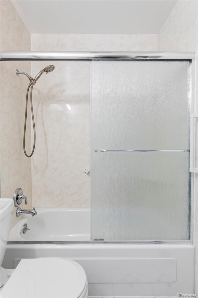 9453 W Utah Pl, Lakewood, CO 80232 - full bath featuring toilet and combined bath / shower with glass door