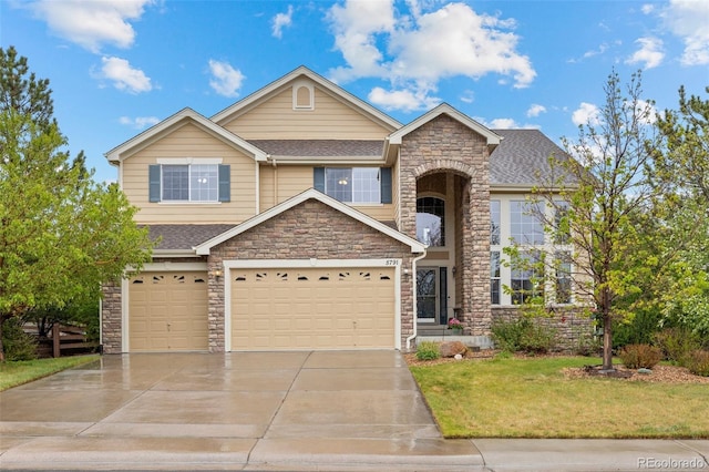view of front of property with stone siding, driveway, a front yard, a shingled roof, and a garage
