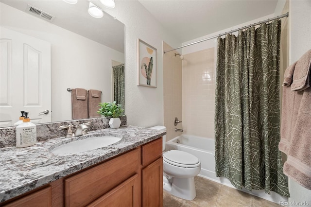 bathroom with vanity, shower / tub combo with curtain, tile patterned flooring, and toilet