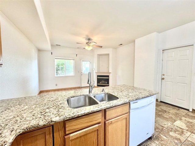2247 Coronado Pkwy N # D, Denver, CO 80229 - kitchen featuring dishwasher, a sink, a glass covered fireplace, open floor plan, and a ceiling fan