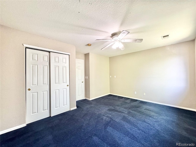 2247 Coronado Pkwy N # D, Denver, CO 80229 - unfurnished bedroom with dark colored carpet, ceiling fan, a closet, and baseboards