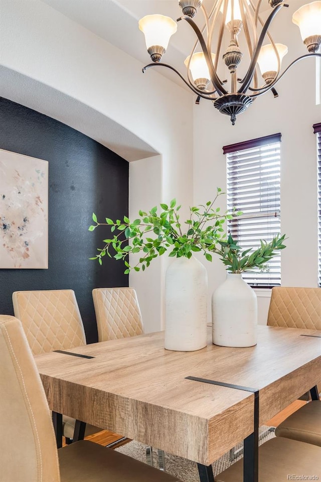 dining area with an inviting chandelier