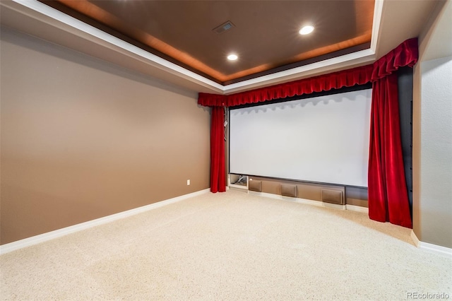 carpeted cinema with visible vents, a tray ceiling, baseboards, and recessed lighting