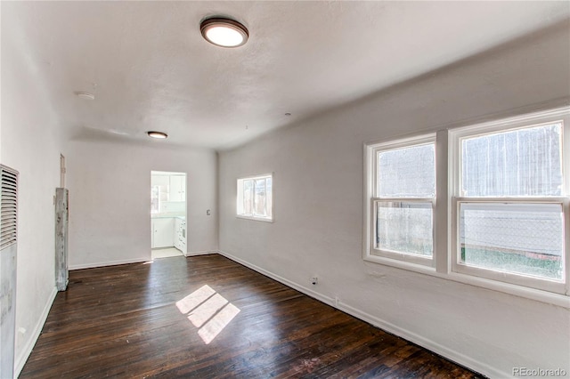 empty room featuring dark hardwood / wood-style floors