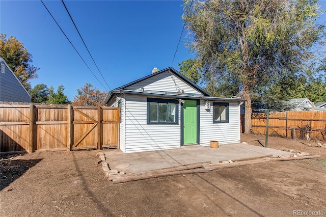 back of house featuring a patio