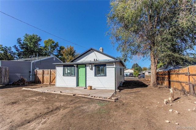 rear view of property with a patio area