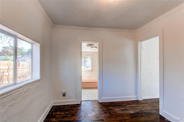 unfurnished room with ornamental molding, dark hardwood / wood-style floors, and plenty of natural light