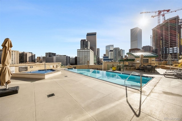 view of pool featuring a patio