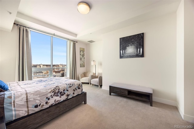 bedroom with light colored carpet