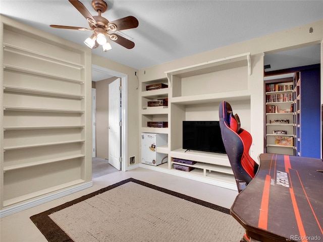 13133 Regulus Dr, Lone Tree, CO 80124 - living room with a ceiling fan, built in shelves, and concrete floors