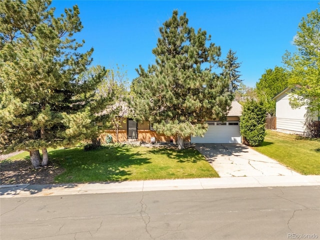 13133 Regulus Dr, Lone Tree, CO 80124 - obstructed view of property with concrete driveway, a front yard, and an attached garage