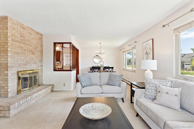 3298 Quail St, Wheat Ridge, CO 80033 - living room with a chandelier, light carpet, a textured ceiling, a fireplace, and a baseboard heating unit