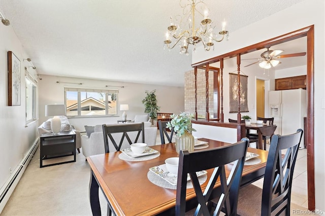 3298 Quail St, Wheat Ridge, CO 80033 - dining space with baseboard heating, a textured ceiling, ceiling fan, and a chandelier