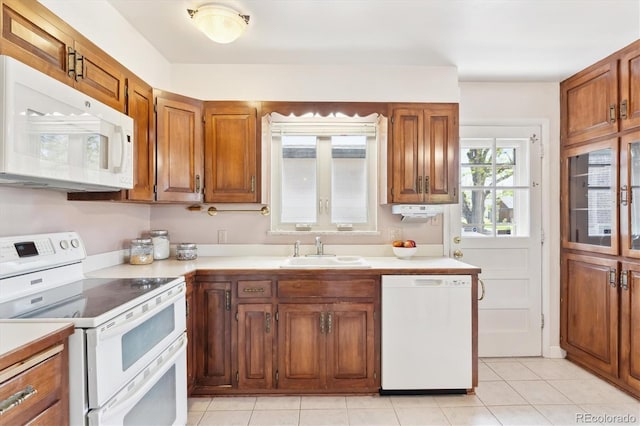 3298 Quail St, Wheat Ridge, CO 80033 - kitchen featuring white appliances, a sink, light countertops, and brown cabinets
