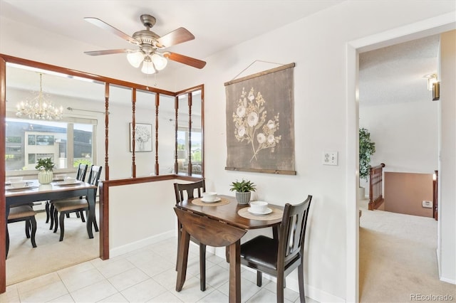3298 Quail St, Wheat Ridge, CO 80033 - dining area featuring light carpet, a ceiling fan, a chandelier, baseboards, and light tile patterned floors