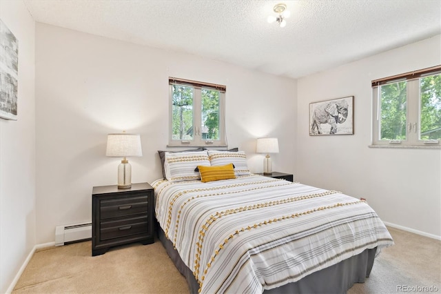 3298 Quail St, Wheat Ridge, CO 80033 - bedroom featuring a baseboard heating unit, light carpet, multiple windows, and a textured ceiling