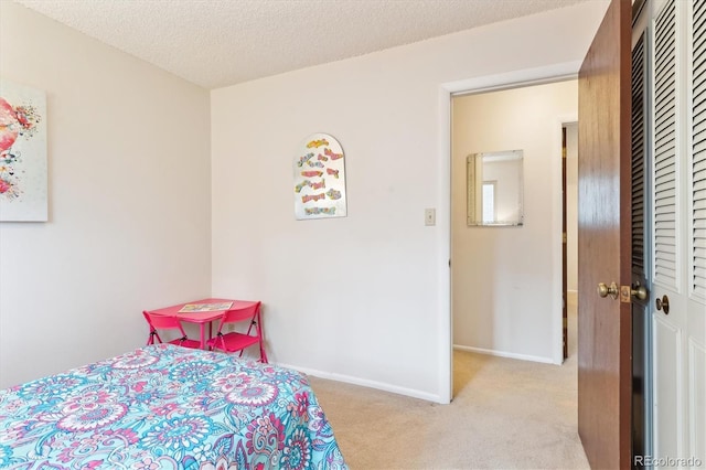 3298 Quail St, Wheat Ridge, CO 80033 - bedroom with a closet, carpet floors, baseboards, and a textured ceiling