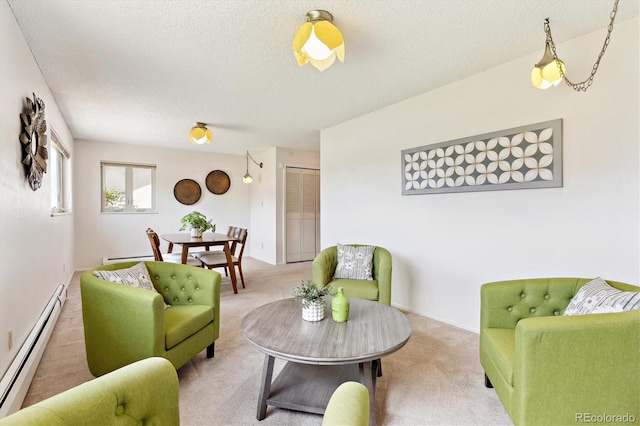 3298 Quail St, Wheat Ridge, CO 80033 - living area featuring a baseboard heating unit, carpet, and a textured ceiling