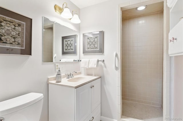 3298 Quail St, Wheat Ridge, CO 80033 - bathroom with toilet, tiled shower, and vanity