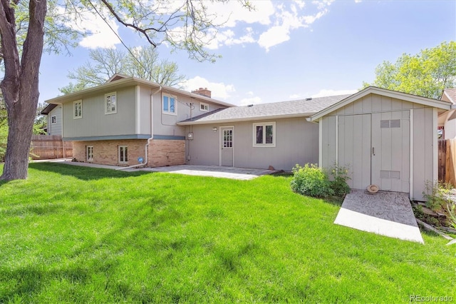 3298 Quail St, Wheat Ridge, CO 80033 - rear view of property with a patio, a storage shed, an outbuilding, and a chimney